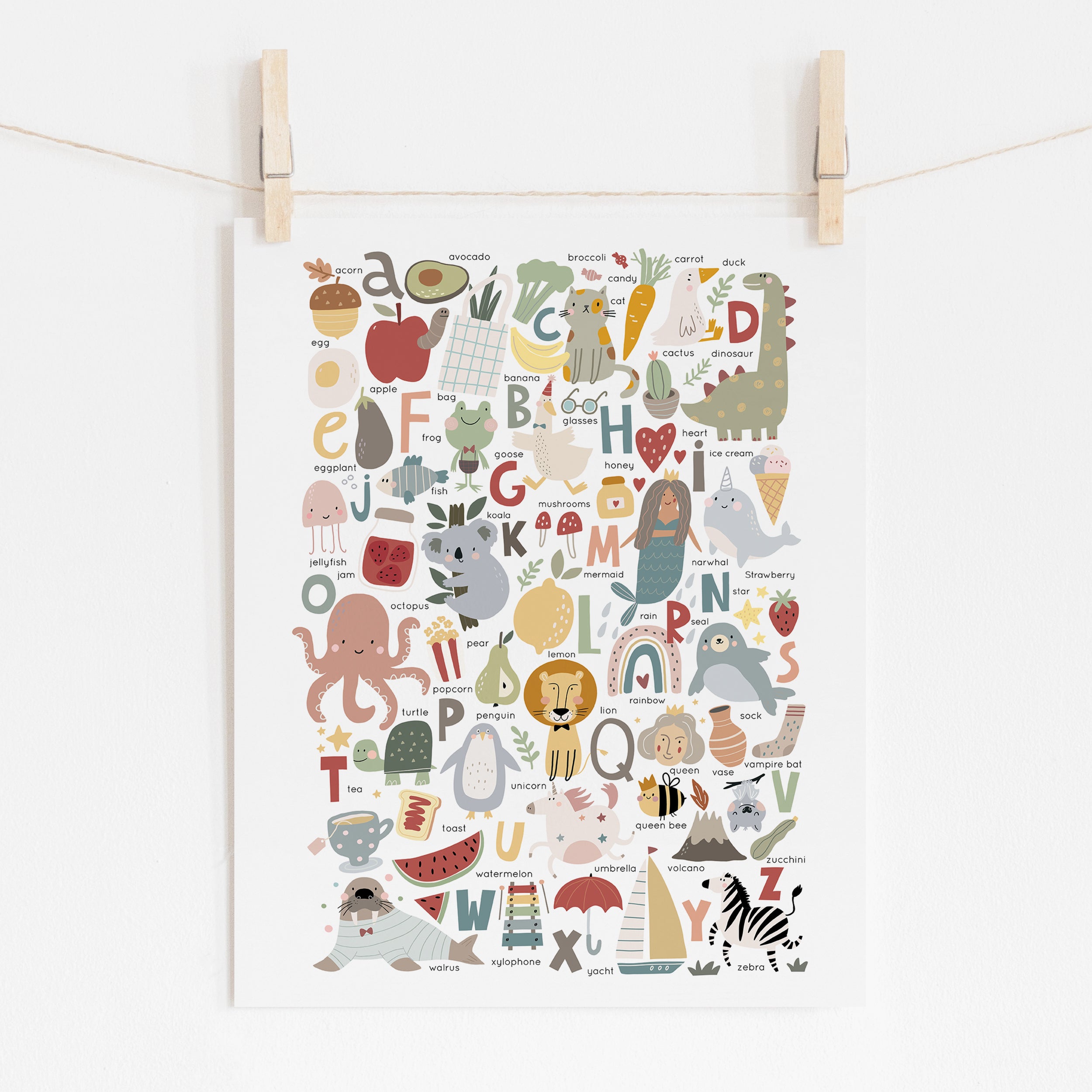 A neutral pastel colored poster of the alphabet with animals and objects for nurseries and kids bedrooms