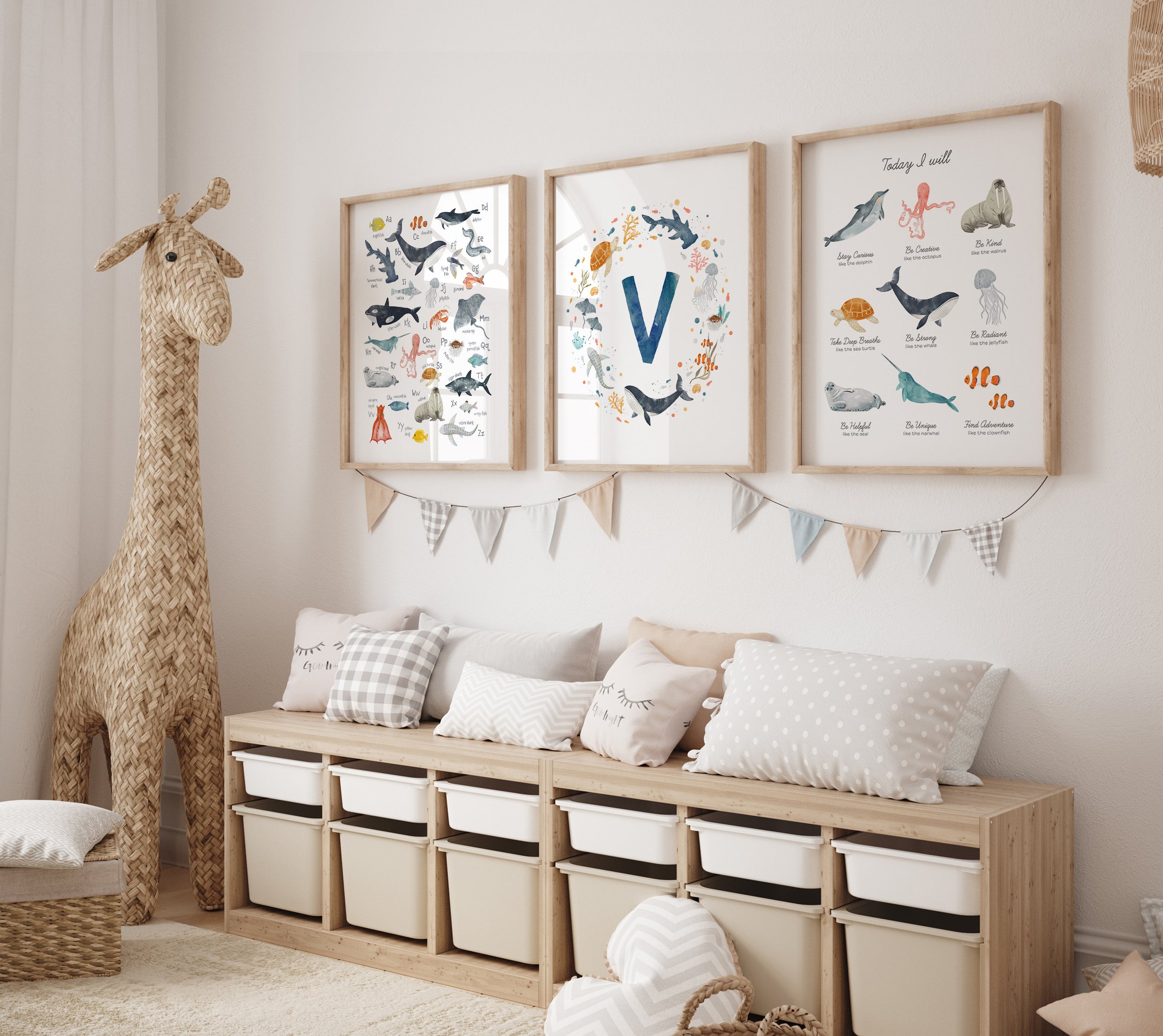 Set of three ocean theme nursery prints displayed above an ikea toy shelf with cushions